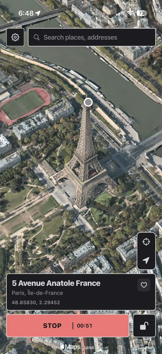 PinDrift on iPhone reporting a location at the Eiffel Tower in Paris, with live coordinates and a running session timer